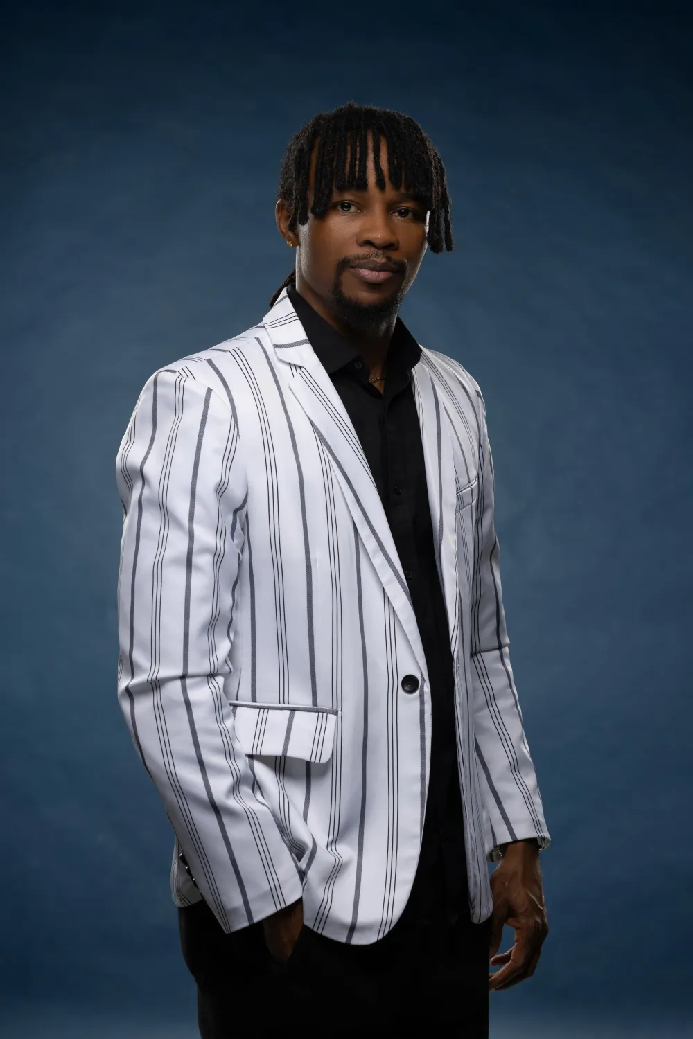 Ekene Eze in a striped blazer